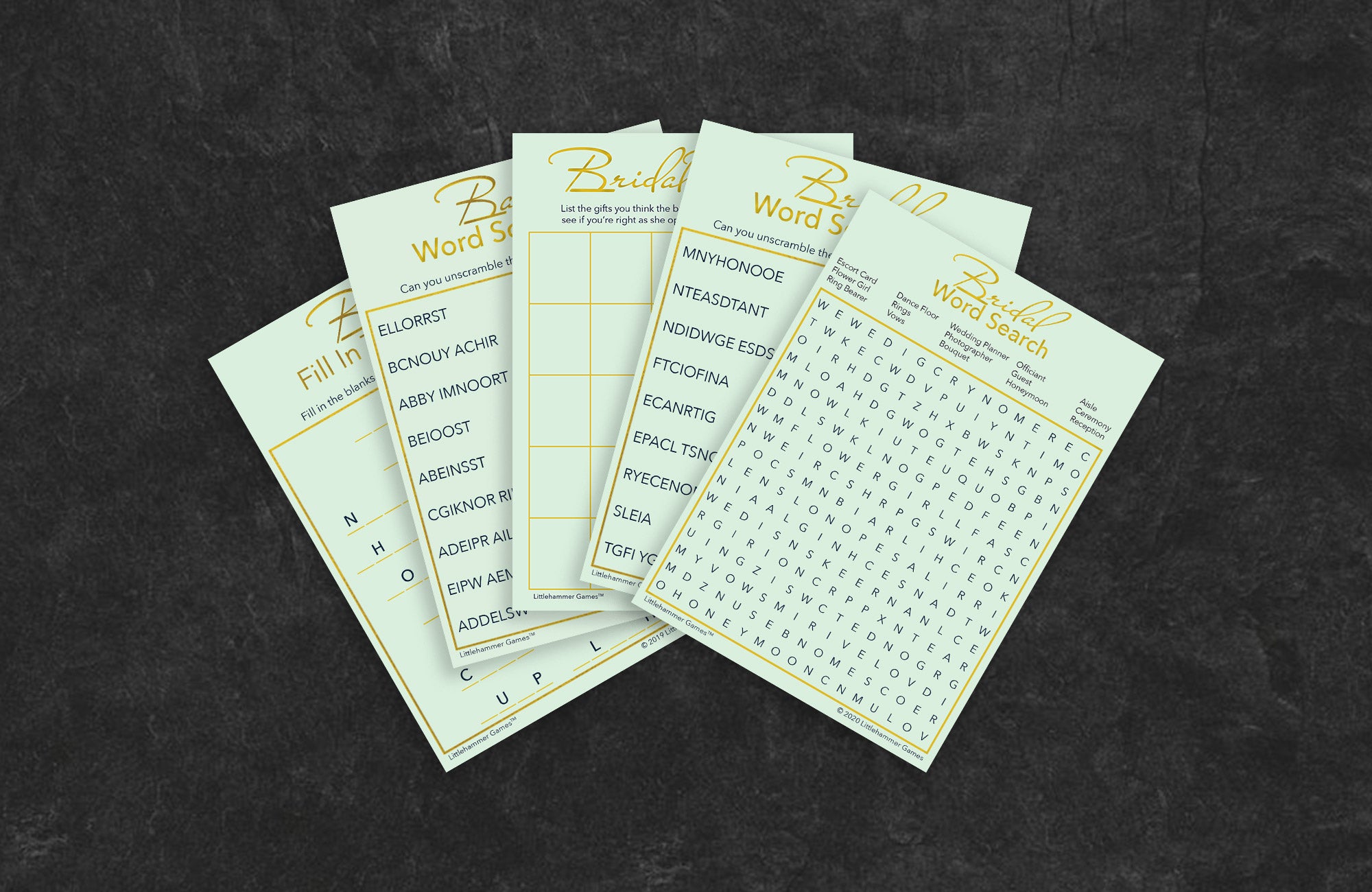 Mint and gold game cards fanned out on a slate background