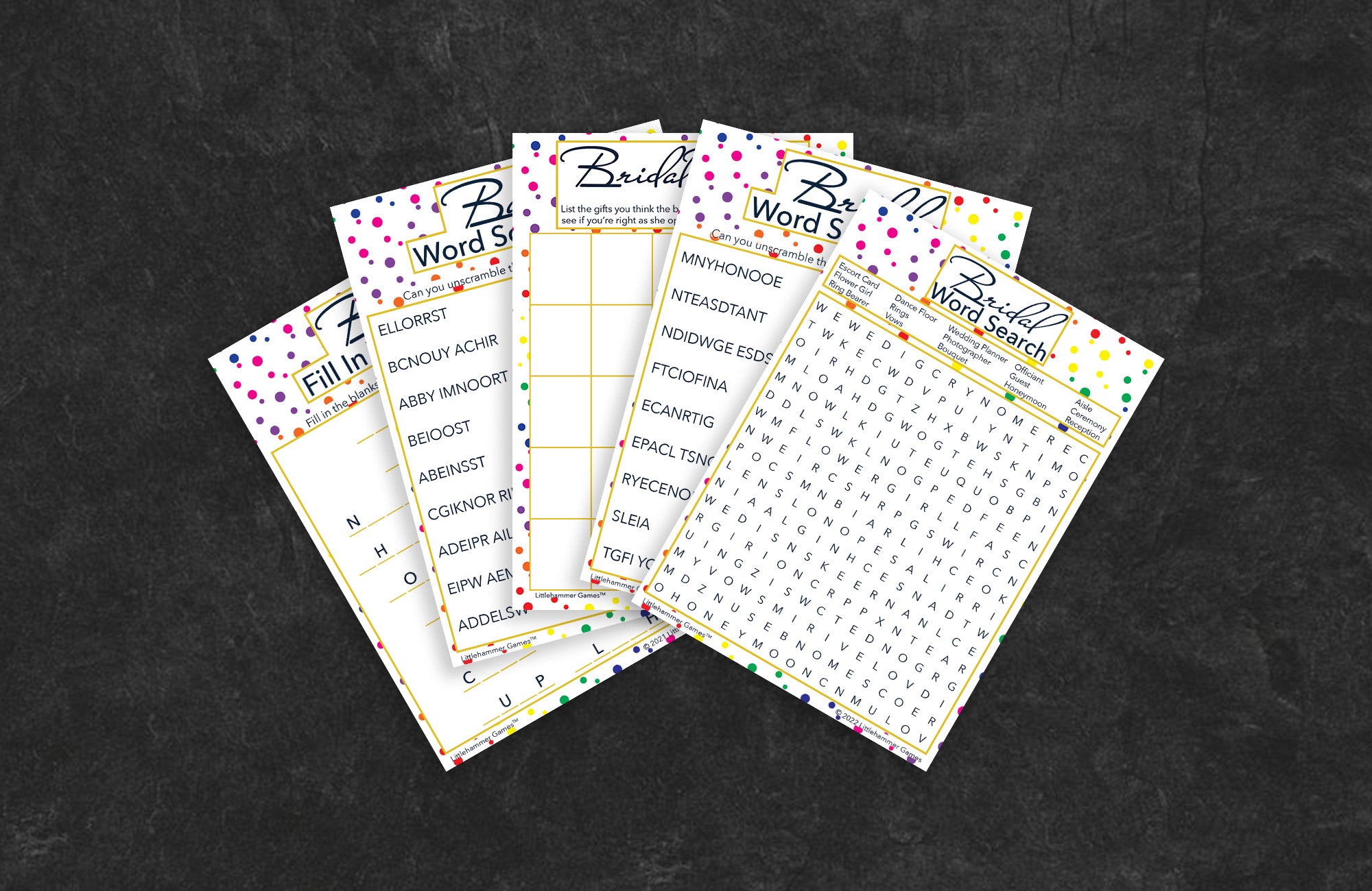 Rainbow polka dot game cards fanned out on a slate background