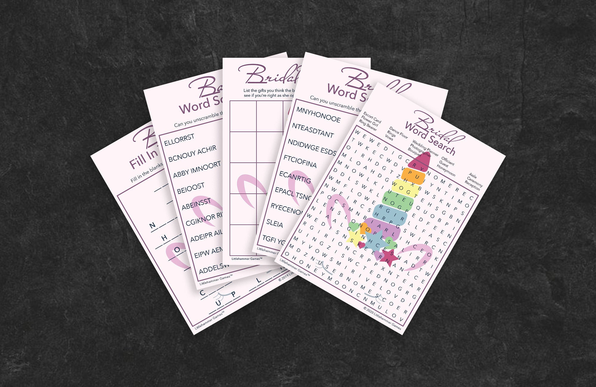 Unicorn-themed game cards fanned out on a slate background