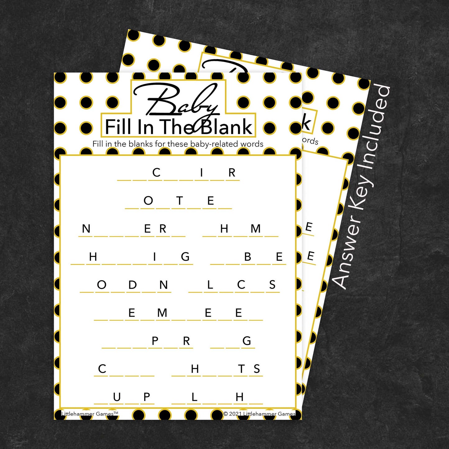 Baby Fill in the Blank game card with a black and gold polka dot background with answer card tucked behind it on a slate background with white text that says "Answer Key Included"