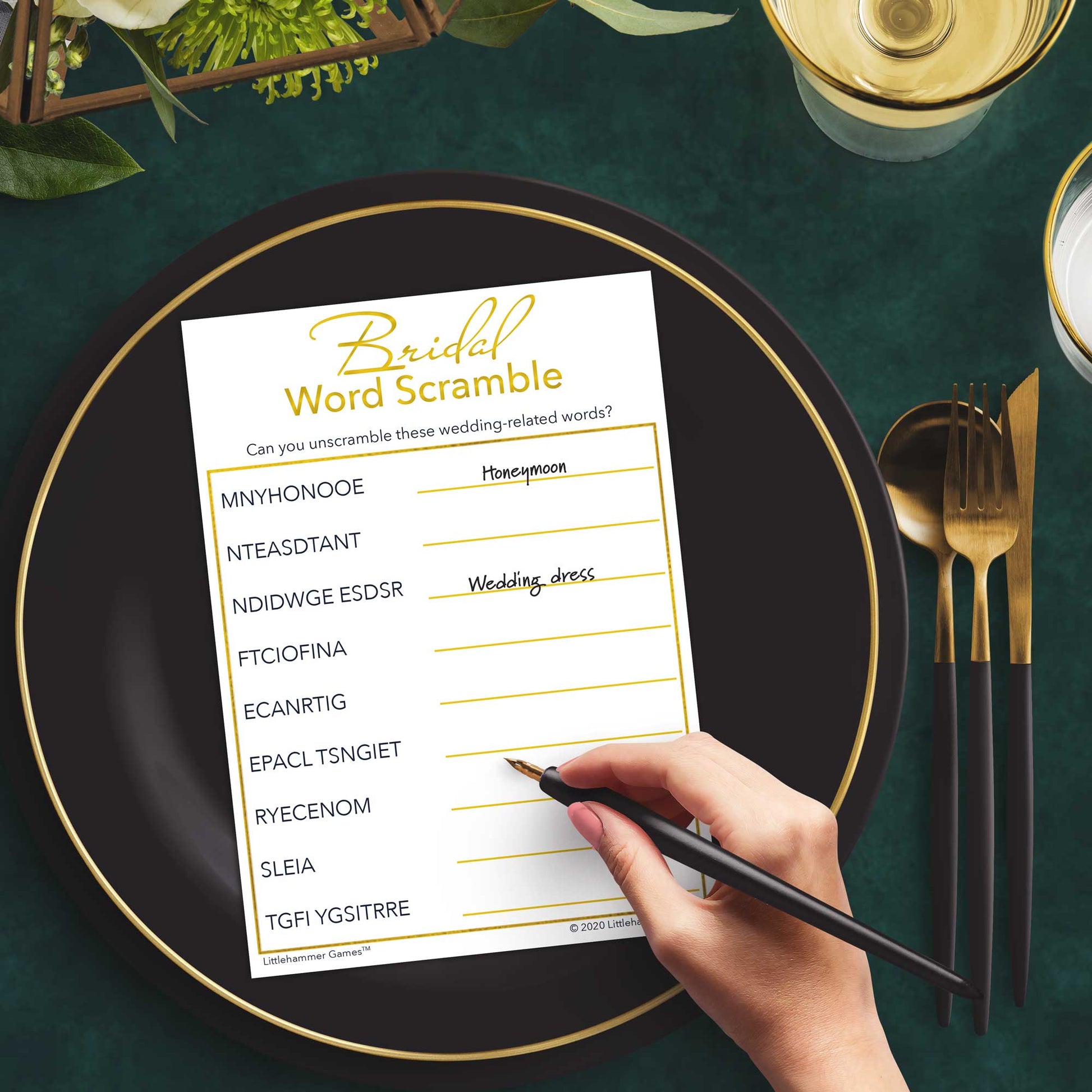 Woman with a pen playing a gold and white Bridal Word Scramble game card at a dark place setting