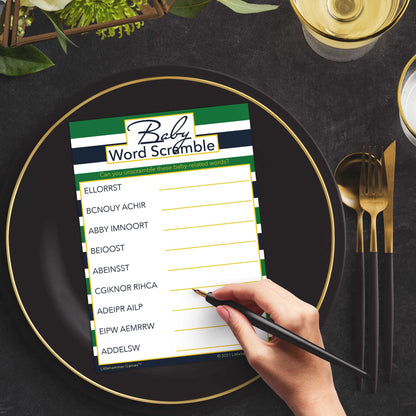 Woman playing a green and navy-striped Baby Word Scramble game card at a green and black place setting
