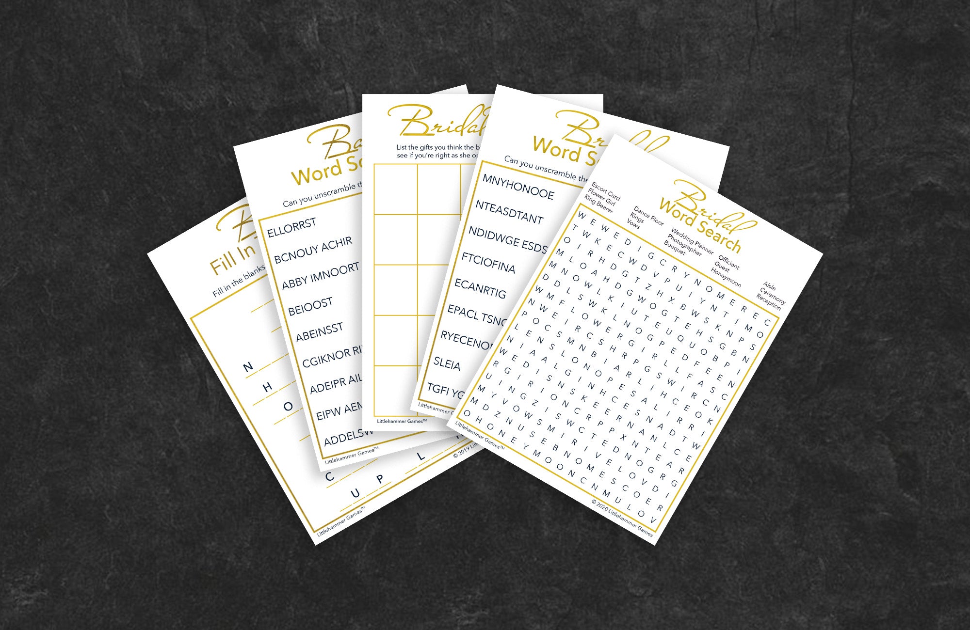 Gold and white game cards fanned out on a slate background