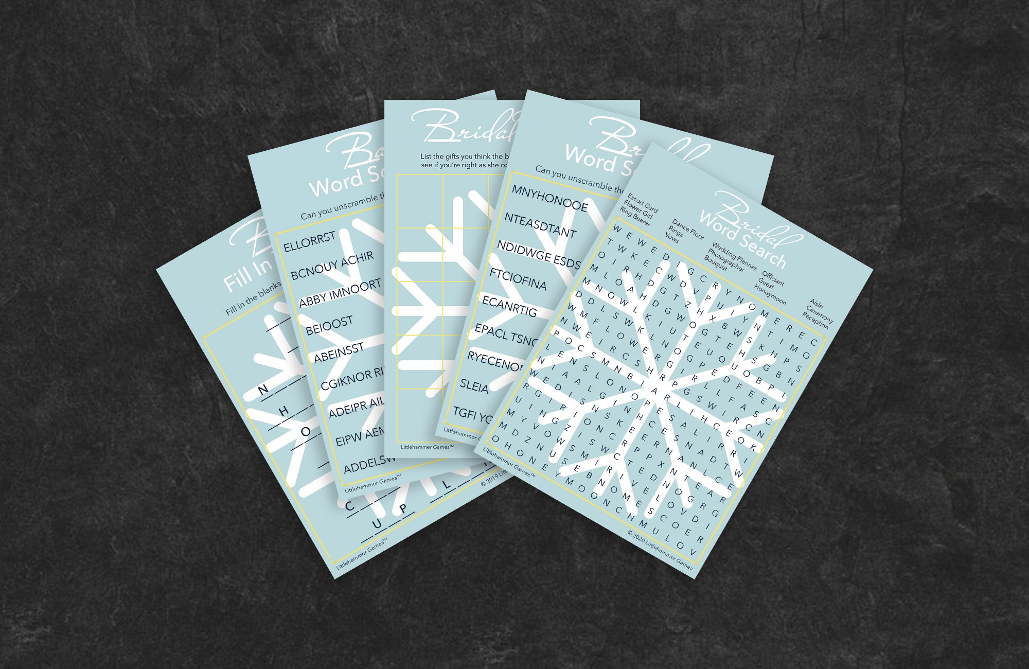 Snowflake-themed game cards fanned out on a slate background