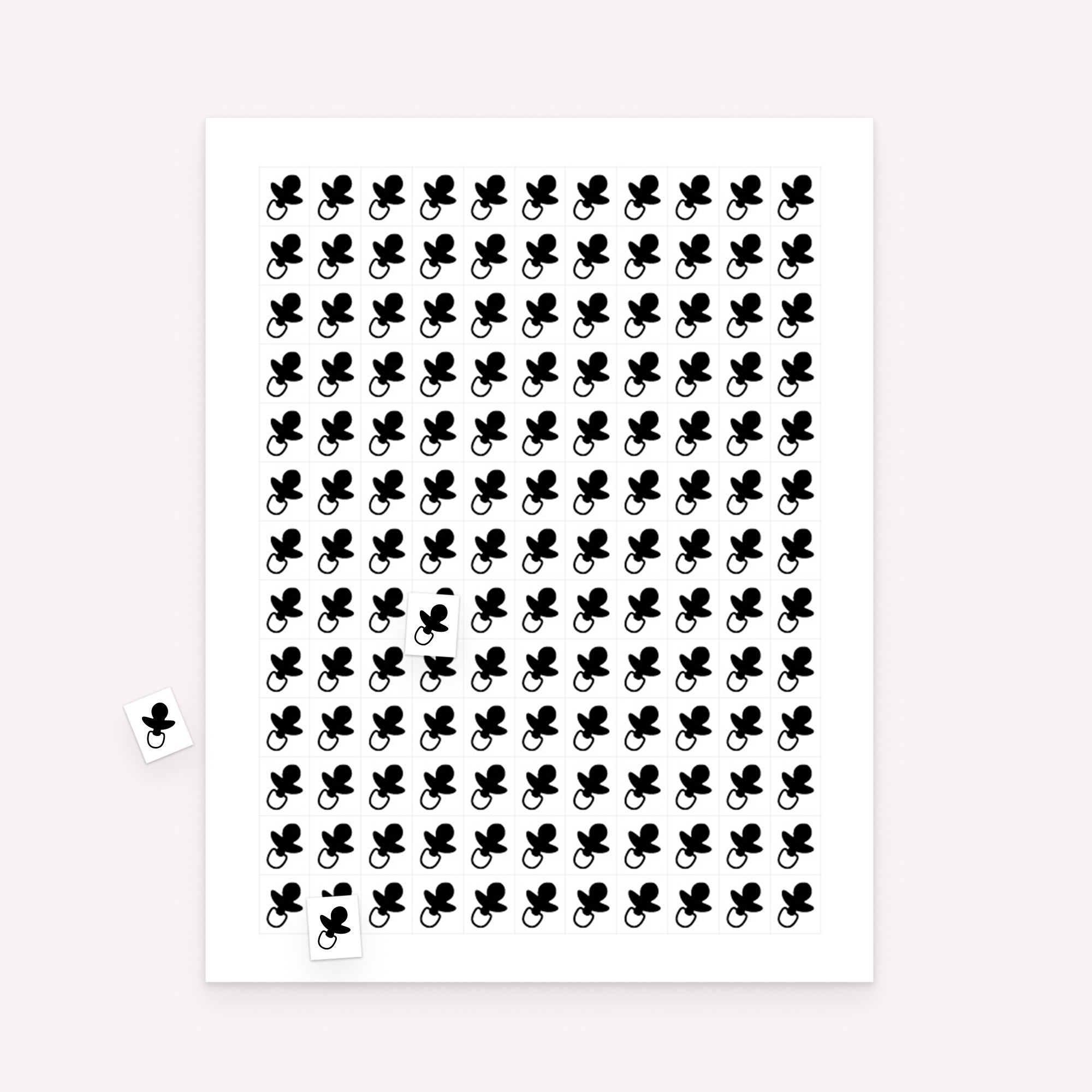 Printable baby shower bingo markers sheet with small rectangular markers and scattered sample pieces for gameplay