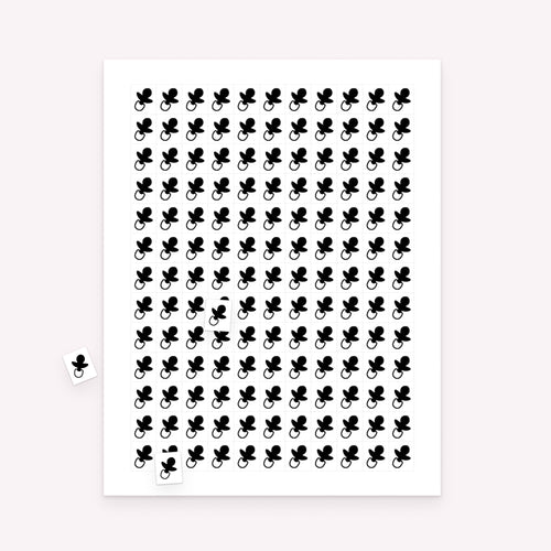 Printable baby shower bingo markers sheet with small rectangular markers and scattered sample pieces for gameplay