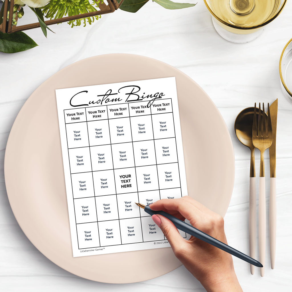 Custom bingo card on a plate with a hand holding a pen, set against a dining table background.