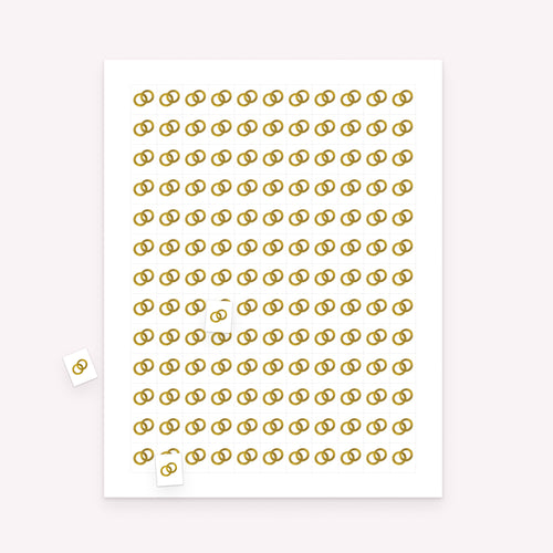 Printable wedding bingo markers sheet with rectangular markers and scattered pieces for bride and groom game