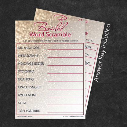 Bridal Word Scramble game card with a glittery rose gold background with answer card tucked behind it on a slate background with white text that says "Answer Key Included"