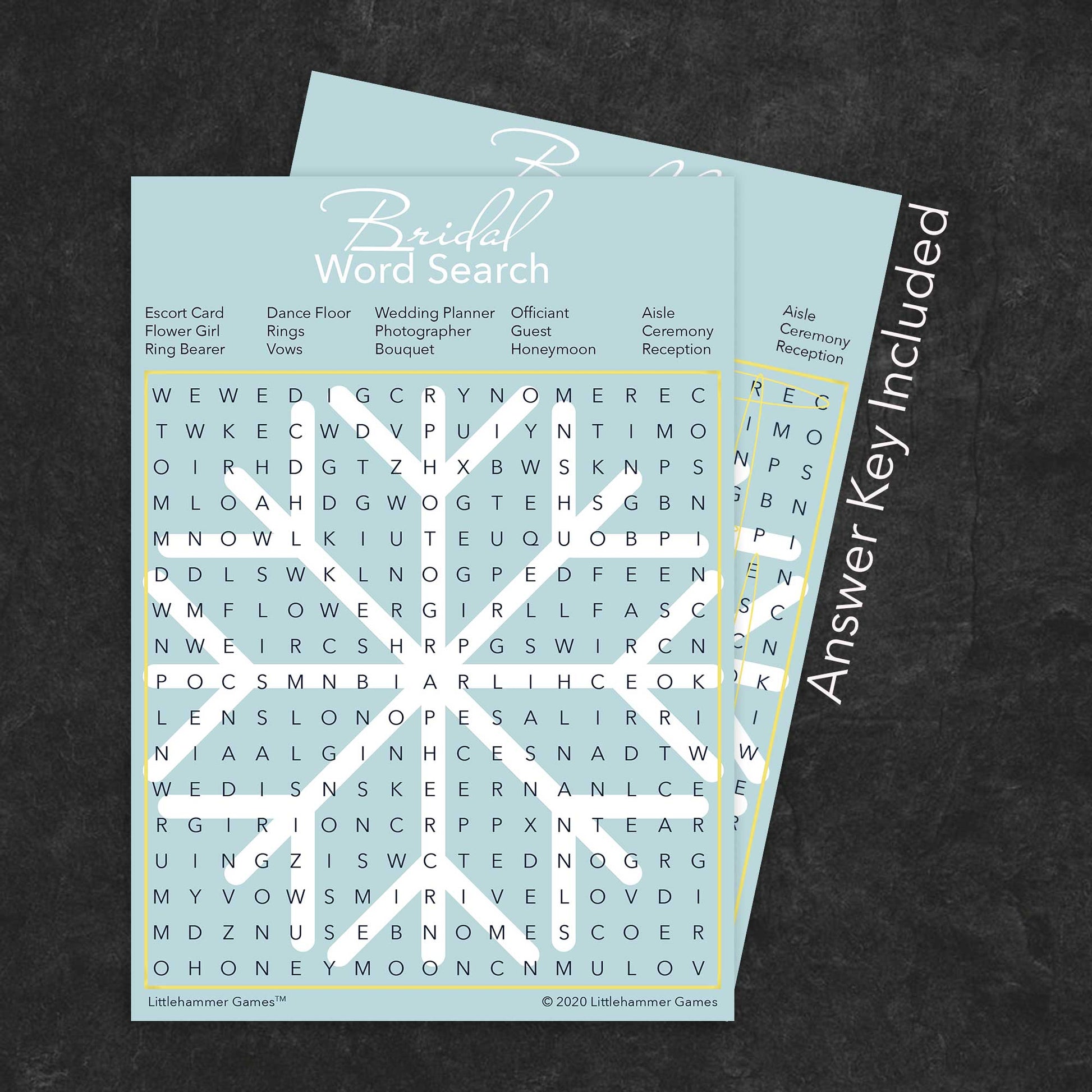 Bridal Word Search game card with a snowflake-themed background with answer card tucked behind it on a slate background with white text that says "Answer Key Included"