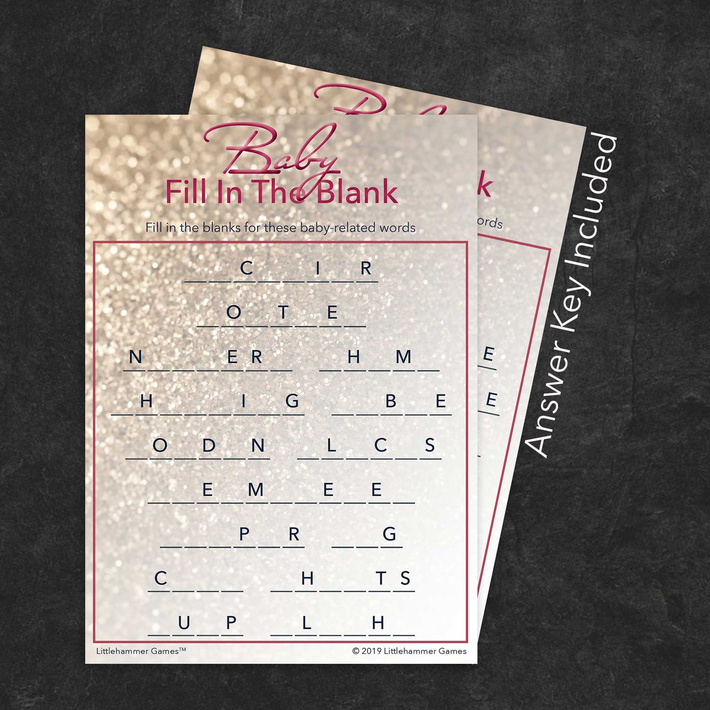 Baby Fill in the Blank game card with a glittery rose gold background with answer card tucked behind it on a slate background with white text that says "Answer Key Included"