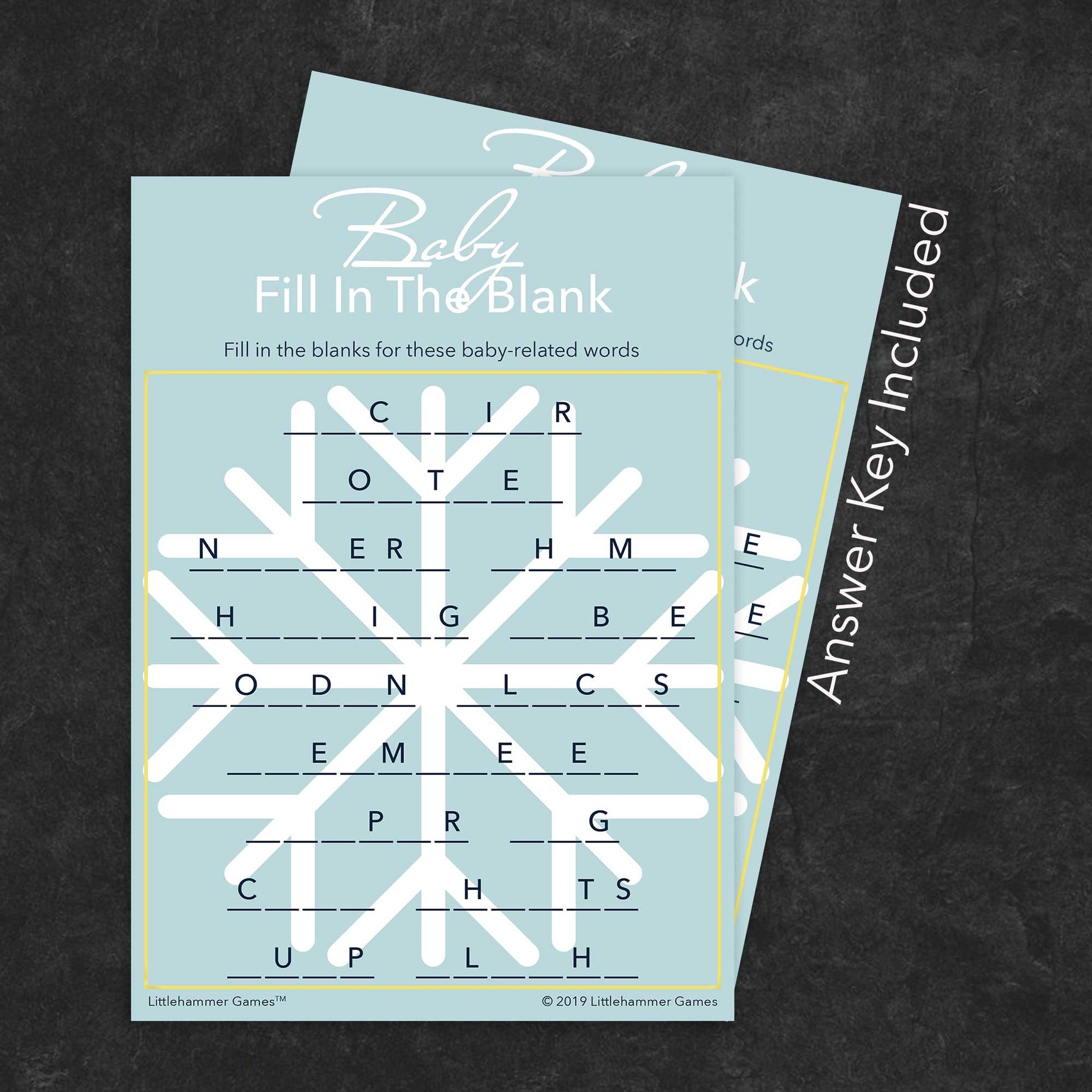 Baby Fill in the Blank game card with a snowflake background with answer card tucked behind it on a slate background with white text that says "Answer Key Included"