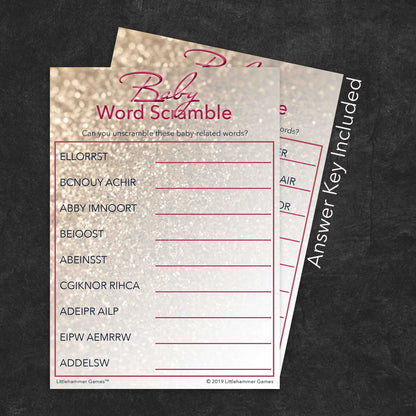 Baby Word Scramble game card with a glittery rose gold background with answer card tucked behind it on a slate background with white text that says "Answer Key Included"