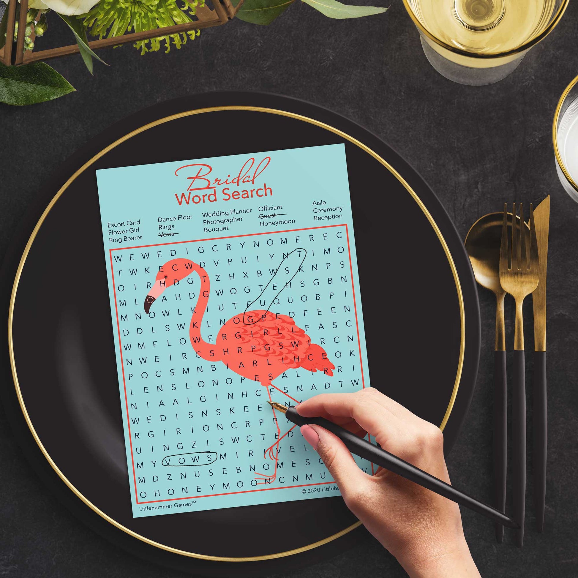 Woman with a pen playing a flamingo Bridal Word Search game card at a dark place setting