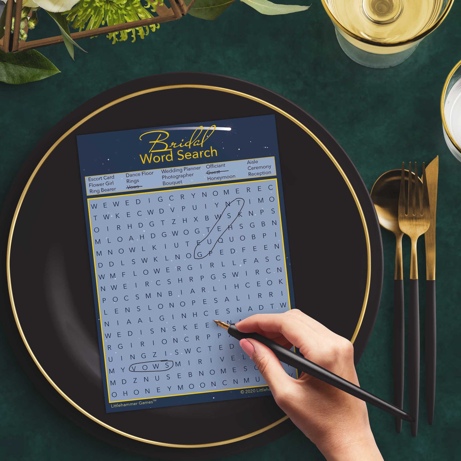 Woman with a pen playing a star-themed Bridal Word Search game card at a dark place setting