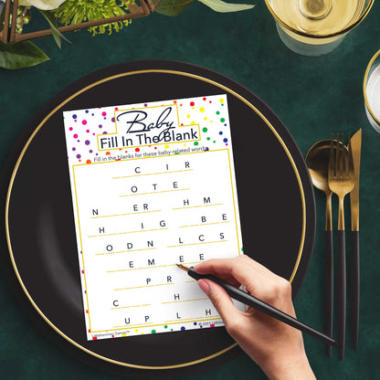 Woman with a pen playing a rainbow polka dot Baby Fill in the Blank game card at a dark place setting
